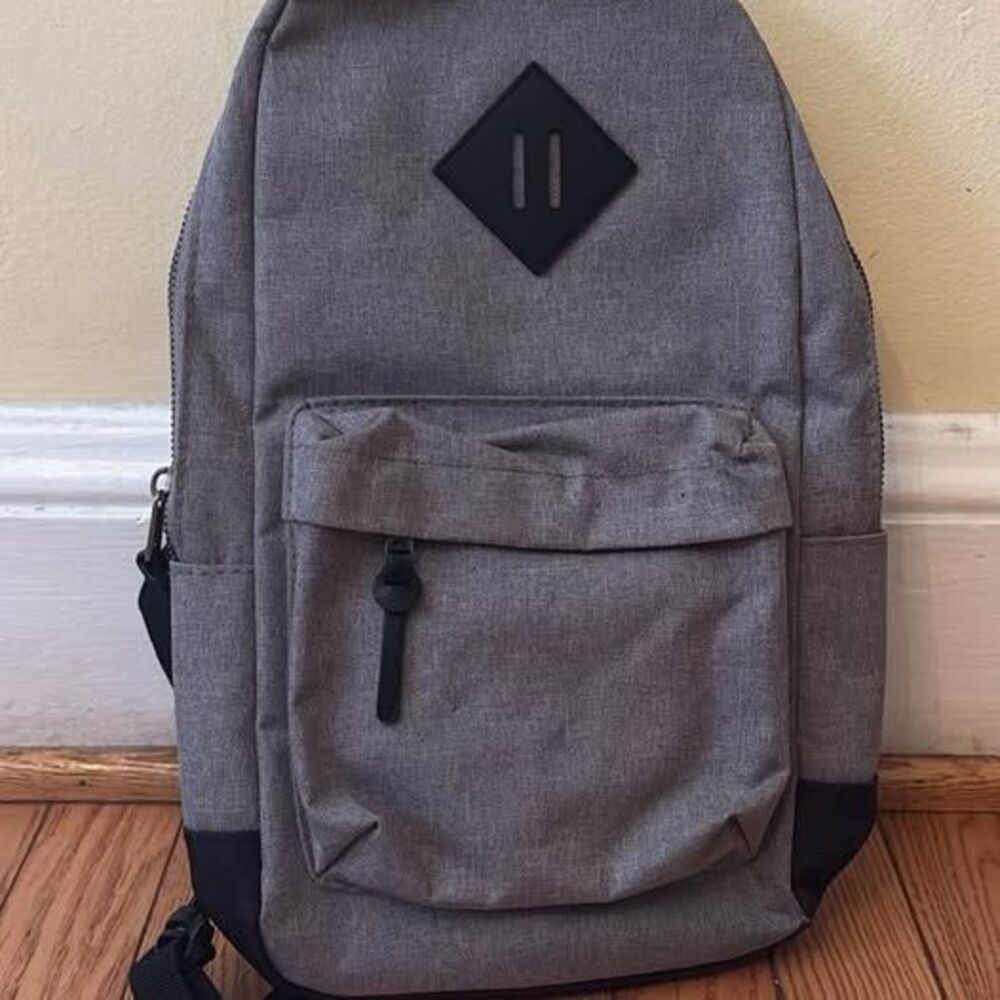 Crossbody bag backpack grey black wide strap has pockets adjustable strap